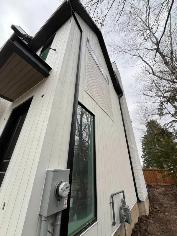 Light vertical siding on a narrow side wall